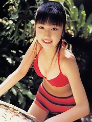 Cute petite asian babe allurs and intices in her red bikini