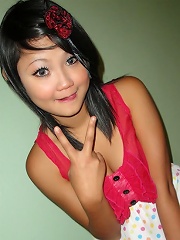 Tiny cute Asian teen doing self shot poses and being naughty