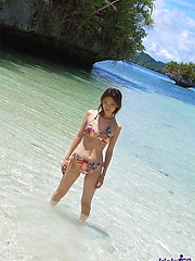 Asian teen strips her bikini off and is enjoying the sun in the nude